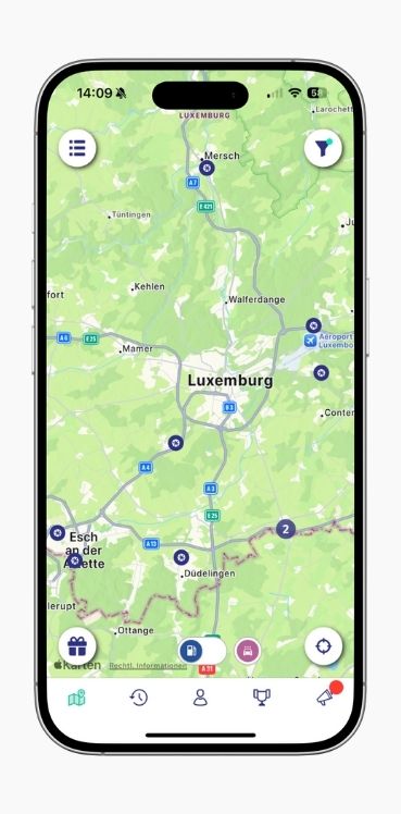A smartphone shows the map view of petrol station locations in Luxembourg in the ryd app.