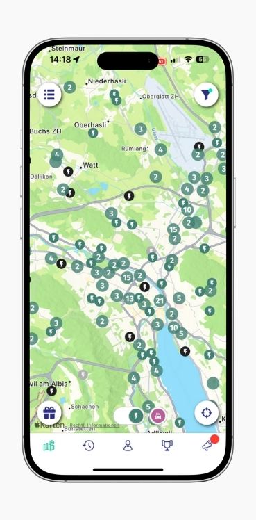 A smartphone shows the map view of charging station locations in Zurich in the ryd app.